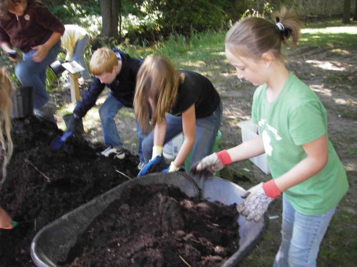 Students from St. Peter's Lutheran School planted flowers in the Mitchell Creek Watershed.